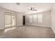 Large living room with neutral walls, lots of natural light and outdoor access at 3449 E Sheffield Rd, Gilbert, AZ 85296
