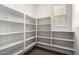 Spacious walk-in pantry offering plenty of shelving for organized storage at 3449 E Sheffield Rd, Gilbert, AZ 85296