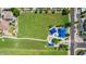 Take in this aerial view of neighborhood green spaces, play structures, and community gathering area at 3668 E Derringer Way, Gilbert, AZ 85297