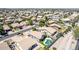 This aerial view shows a swimming pool and well-maintained yards with mature trees at 3668 E Derringer Way, Gilbert, AZ 85297