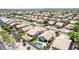 Expansive aerial view showcasing the meticulously planned community, featuring a private pool and well-manicured lawns at 3668 E Derringer Way, Gilbert, AZ 85297