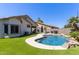 Backyard features a pool, patio area, and desert landscaping at 3668 E Derringer Way, Gilbert, AZ 85297