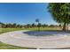 Outdoor basketball court with a well-maintained surface, surrounded by green space, providing a recreational amenity for residents at 3668 E Derringer Way, Gilbert, AZ 85297