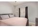 Bedroom with wood-look floors, natural lighting, and simple elegant decor at 3668 E Derringer Way, Gilbert, AZ 85297