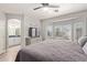 Primary bedroom with bay window overlooking the pool and an ensuite bath at 3668 E Derringer Way, Gilbert, AZ 85297