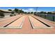 Enjoy a game of bocce ball in the community with these well-maintained courts near a tennis court at 3668 E Derringer Way, Gilbert, AZ 85297