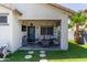 Inviting covered patio with comfortable seating and easy access to backyard at 3668 E Derringer Way, Gilbert, AZ 85297