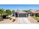 Charming single-story home featuring desert landscaping, a neutral color scheme, and a two-car garage at 3668 E Derringer Way, Gilbert, AZ 85297