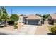 Single-story home with a desert-landscaped front yard and a gray garage door, as seen from an aerial view at 3668 E Derringer Way, Gilbert, AZ 85297