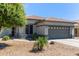 Charming single-story home featuring a gray two-car garage and a well-maintained desert landscape at 3668 E Derringer Way, Gilbert, AZ 85297