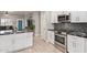 Well-designed kitchen featuring stainless steel appliances, white cabinetry, and open access to living area at 3668 E Derringer Way, Gilbert, AZ 85297