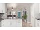 Modern kitchen featuring white cabinets, stylish black marble countertops, and stainless steel appliances at 3668 E Derringer Way, Gilbert, AZ 85297