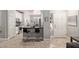 Stylish kitchen featuring sleek white cabinets, a black countertop bar, and stainless steel appliances at 3668 E Derringer Way, Gilbert, AZ 85297