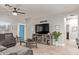 Comfortable living room with a large gray sectional couch and a modern entertainment center at 3668 E Derringer Way, Gilbert, AZ 85297