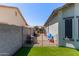 Side yard with gate for privacy, and artificial grass at 3668 E Derringer Way, Gilbert, AZ 85297