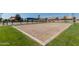 Sand volleyball court with a net, designed for recreational sports and community gatherings, providing an active lifestyle amenity at 3668 E Derringer Way, Gilbert, AZ 85297