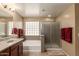 Neutral bathroom features a tiled floor, a tub with shower and an enclosed shower at 3693 E Sparrow Pl, Chandler, AZ 85286
