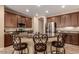 Gourmet kitchen boasts granite countertops, stainless steel appliances, and breakfast bar seating at 3693 E Sparrow Pl, Chandler, AZ 85286