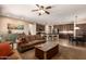 A cozy open-concept floor plan features a living room that flows seamlessly into a modern kitchen and dining area at 3693 E Sparrow Pl, Chandler, AZ 85286