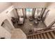 Open-concept living space with high ceilings featuring dining area, seating, and large windows overlooking the pool at 3693 E Sparrow Pl, Chandler, AZ 85286