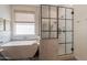 Modern bathroom with freestanding tub, open-concept shower, and ample light at 3931 E Weather Vane Rd, Gilbert, AZ 85296