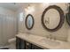 Stylish bathroom features dual sinks, round mirrors, and elegant fixtures at 3931 E Weather Vane Rd, Gilbert, AZ 85296