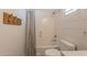 Clean bathroom features a toilet, bath tub with curtain, and neutral color palette at 3931 E Weather Vane Rd, Gilbert, AZ 85296