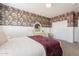 Charming bedroom features floral wallpaper, and a well-appointed closet at 3931 E Weather Vane Rd, Gilbert, AZ 85296