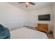 Cozy bedroom featuring a queen bed, two closets and a television at 3931 E Weather Vane Rd, Gilbert, AZ 85296
