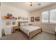Bright bedroom with a sports-themed decor, natural light, and warm carpet at 3931 E Weather Vane Rd, Gilbert, AZ 85296