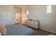 Cozy bedroom featuring neutral tones, natural light, and paneled accent wall at 3931 E Weather Vane Rd, Gilbert, AZ 85296