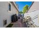 Side view of the home featuring the pool's utilities at 3931 E Weather Vane Rd, Gilbert, AZ 85296