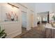 Spacious foyer with hardwood floors, decorative wall art, and an open layout leading to other rooms at 3931 E Weather Vane Rd, Gilbert, AZ 85296