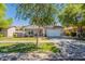 Charming two-story home featuring a well-manicured lawn and a welcoming front porch with stone accents at 3931 E Weather Vane Rd, Gilbert, AZ 85296