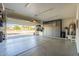 Well-lit garage with ample storage, epoxy flooring, and high ceilings at 3931 E Weather Vane Rd, Gilbert, AZ 85296