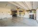 Spacious garage with ample storage, epoxy flooring, and well-organized shelving at 3931 E Weather Vane Rd, Gilbert, AZ 85296