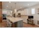 Well-equipped kitchen with white cabinets, a center island, and stainless steel appliances at 3931 E Weather Vane Rd, Gilbert, AZ 85296