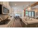 Well-equipped kitchen with gas range, white cabinetry, and a view into the dining area at 3931 E Weather Vane Rd, Gilbert, AZ 85296