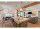 Open-concept kitchen boasts a farmhouse sink, stainless steel appliances, and seamless flow to the living area at 3931 E Weather Vane Rd, Gilbert, AZ 85296