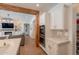 Modern kitchen seamlessly connects to the living area, featuring ample counter space and stainless steel appliances at 3931 E Weather Vane Rd, Gilbert, AZ 85296