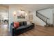 Cozy living room with hardwood floors, comfortable seating, and elegant decor creates a warm and inviting space at 3931 E Weather Vane Rd, Gilbert, AZ 85296