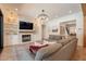 Open living room with fireplace, built-ins, and comfortable seating, perfect for relaxation at 3931 E Weather Vane Rd, Gilbert, AZ 85296