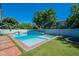 A backyard featuring a luxurious pool, and well maintained turf at 3931 E Weather Vane Rd, Gilbert, AZ 85296