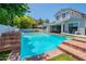 Backyard featuring a large pool and the home's exterior at 3931 E Weather Vane Rd, Gilbert, AZ 85296