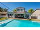 Backyard featuring a pool and the exterior of the home at 3931 E Weather Vane Rd, Gilbert, AZ 85296