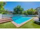 A backyard featuring a pool with well kept artificial grass all around at 3931 E Weather Vane Rd, Gilbert, AZ 85296