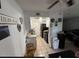 Galley style kitchen features tile floors, white cabinets and a full appliance package in a cozy layout at 4002 W Palomino Rd, Phoenix, AZ 85019
