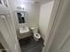 Efficient bathroom with contemporary fixtures, including sink and toilet at 4111 W Reade Ave, Phoenix, AZ 85019