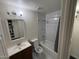Modern bathroom with tub, shower, and sink at 4111 W Reade Ave, Phoenix, AZ 85019