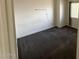 An empty bedroom features a large window that lets in natural lighting at 4111 W Reade Ave, Phoenix, AZ 85019